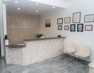 waiting room and front desk inside of Dental Beauty in Feasterville, PA