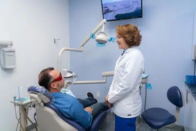 Dr. Kurudimova talking with a patient about his upcoming oral surgery procedure at Dental Beauty in Feasterville, PA