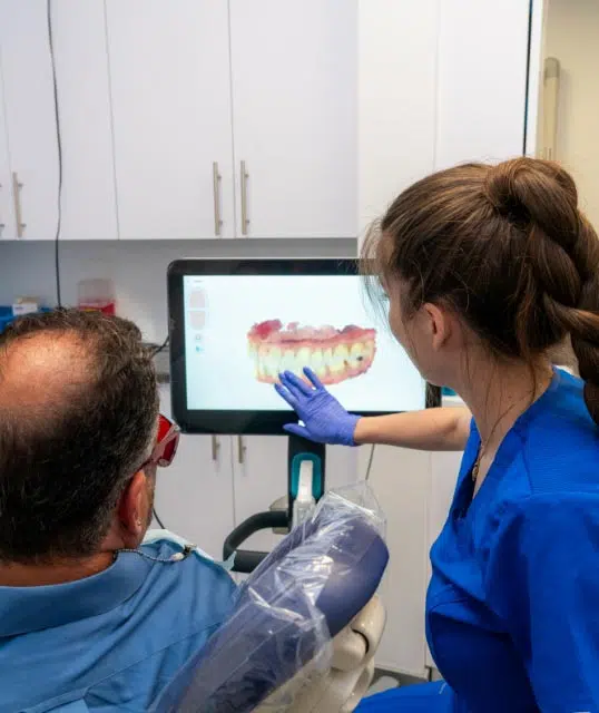 patient reviewing his dental x-rays at Dental Beauty in Feasterville, PA